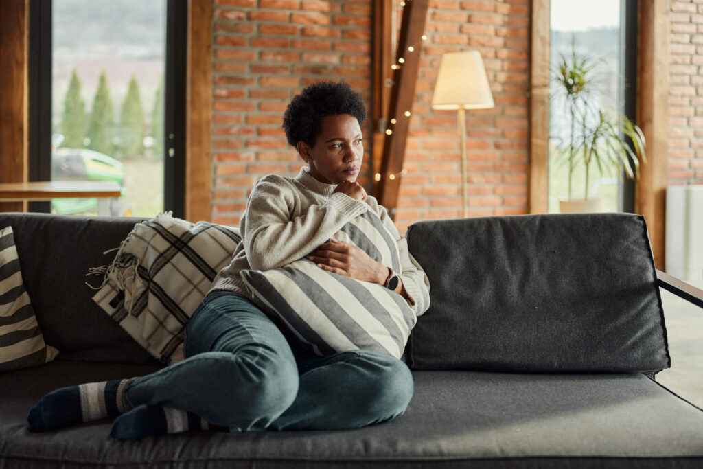 Another-Pensive-Woman-on-a-Couch-1